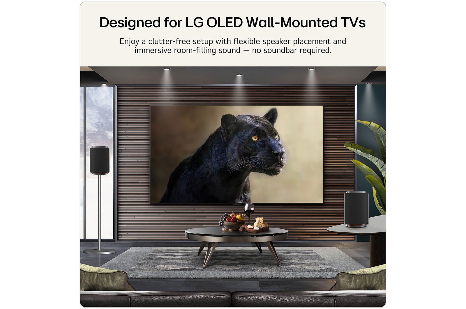 LG Stereo 5 wireless speakers positioned beside an LG OLED wall-mounted TV, delivering immersive room-filling audio in a modern living room.